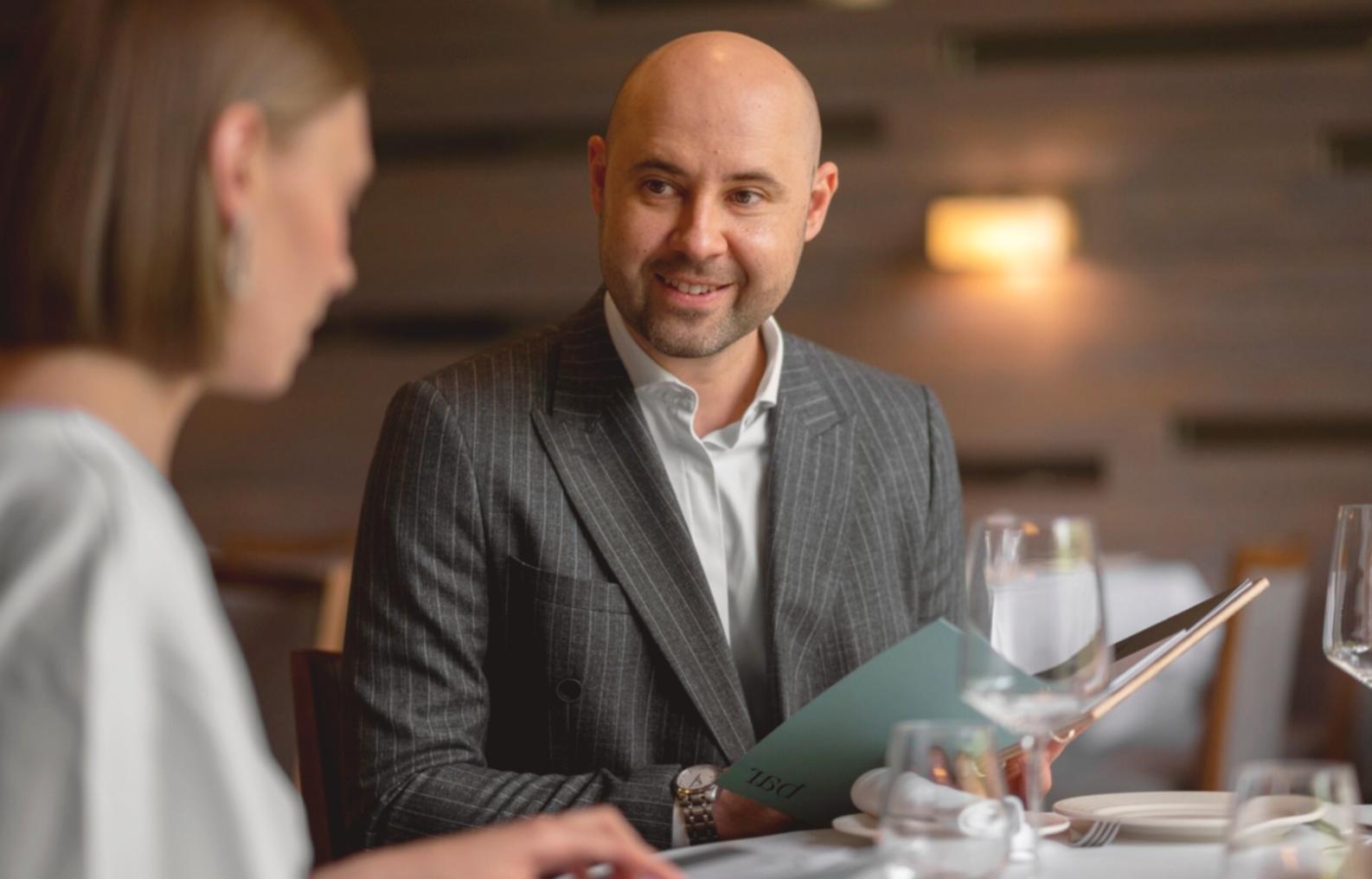 Person reviewing financial documents and budget spreadsheets
