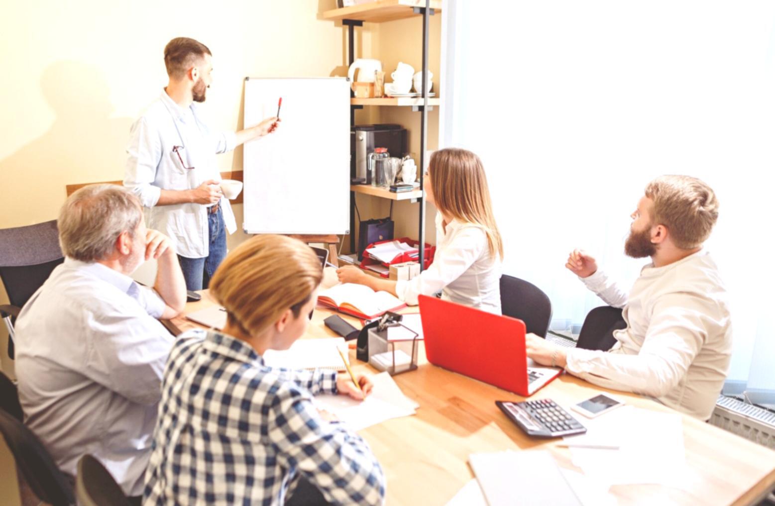 Business owner reviewing financial reports and budget documents